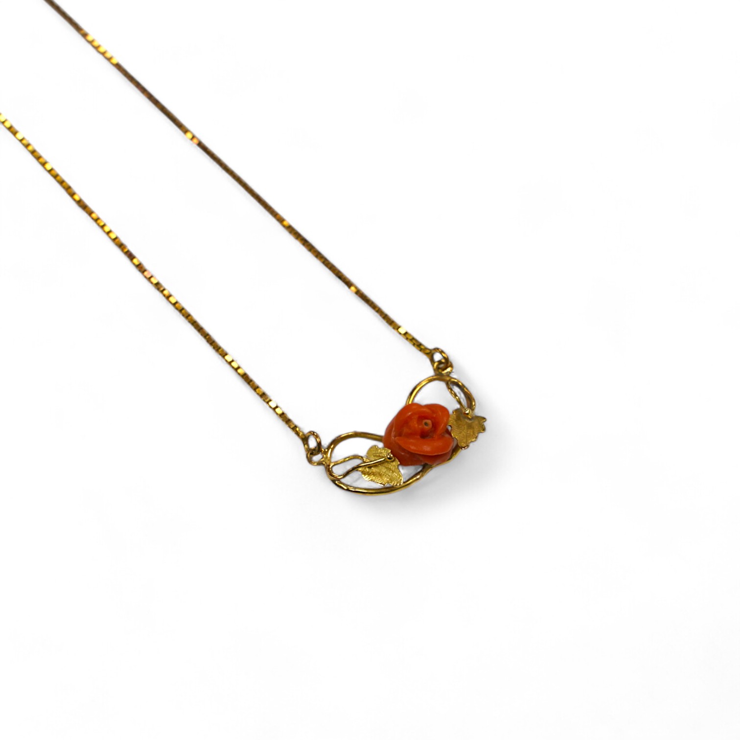 A modern Italian 18k and carved coral set pendant necklace, 40cm, gross weight 5.2 grams. Condition - fair to good